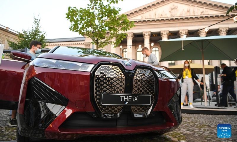 A BMW iX is on display at the BMW outdoor booth during the International Motor Show Germany (IAA Mobility) in Munich, Germany, Sept. 8, 2021. With the slogan What will move us next, IAA Mobility focuses on green mobility, featuring electric cars and even bicycles.Photo: Xinhua