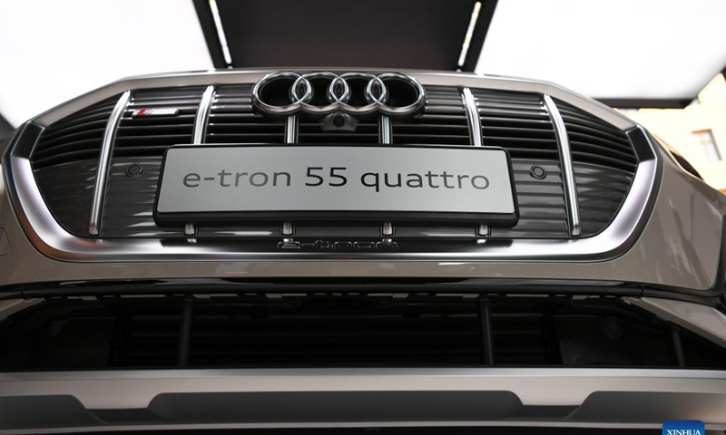 An Audi e-tron 55 quattro is on display at the Audi outdoor booth during the International Motor Show Germany (IAA Mobility) in Munich, Germany, Sept. 8, 2021. With the slogan What will move us next, IAA Mobility focuses on green mobility, featuring electric cars and even bicycles.Photo: Xinhua 