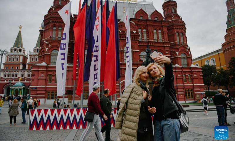 People take a selfie on Manezhnaya Square during the Moscow City Day celebrations in Moscow, Russia, Sept. 11, 2021. Moscow celebrated its 874th anniversary to honor the city's founding this weekend. Photo: Xinhua