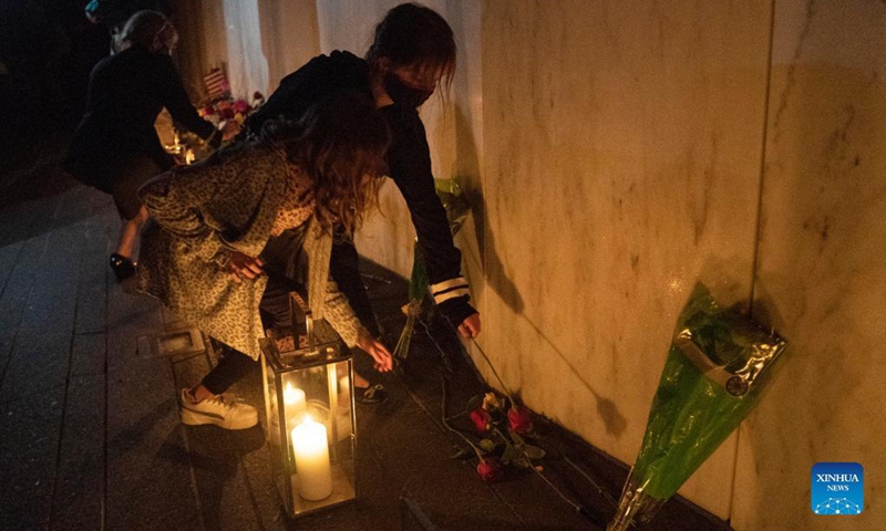 People visit the Wall of Names during a candlelight memorial to the passengers and crew of United Airlines Flight 93 in Shanksville, Pennsylvania, the United States, Sept. 10, 2021. Memorials were held at the Flight 93 National Memorial in Pennsylvania to mark the 20th anniversary of the Sept. 11 attacks.(Photo: Xinhua)