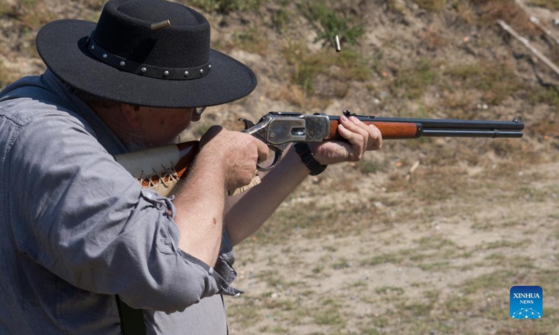 A man competes at the Cowboy Action Shooting Hungarian Championship in Jaszfelsoszentgyorgy, Hungary on Sept. 11, 2021. (Photo: Xinhua)