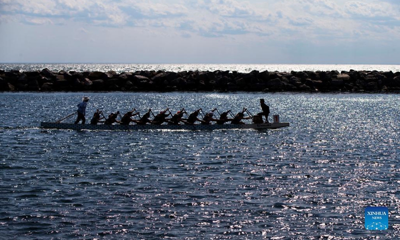 Contestants paddle in the Lake Ontario during the 2021 Toronto International Dragon Boat Race Festival in Toronto, Canada, on Sept. 11, 2021. Peddlers from Canada, the United States, the Caribbean Islands, Europe and Asia participated in the event which kicked off on Saturday.Photo: Xinhua