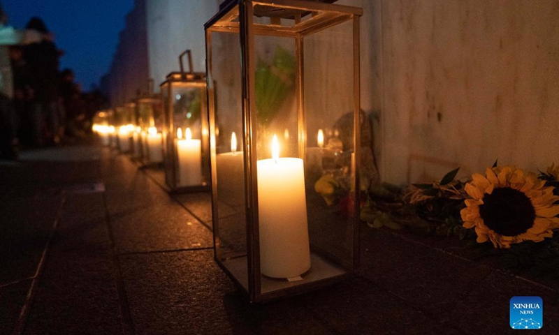 Lanterns are placed at the Wall of Names during a candlelight memorial to the passengers and crew of United Airlines Flight 93 in Shanksville, Pennsylvania, the United States, Sept. 10, 2021. Memorials were held at the Flight 93 National Memorial in Pennsylvania to mark the 20th anniversary of the Sept. 11 attacks.(Photo: Xinhua)
