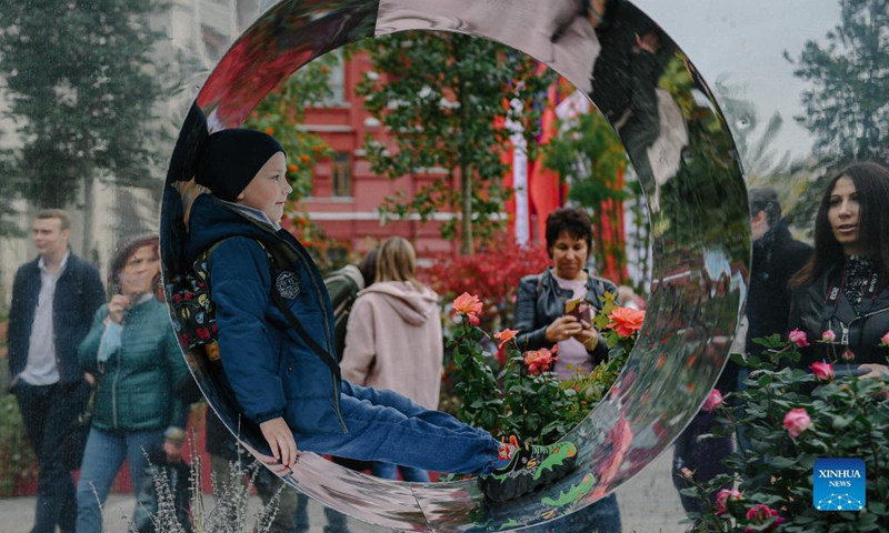 People take a selfie on Manezhnaya Square during the Moscow City Day celebrations in Moscow, Russia, Sept. 11, 2021. Moscow celebrated its 874th anniversary to honor the city's founding this weekend. Photo: Xinhua