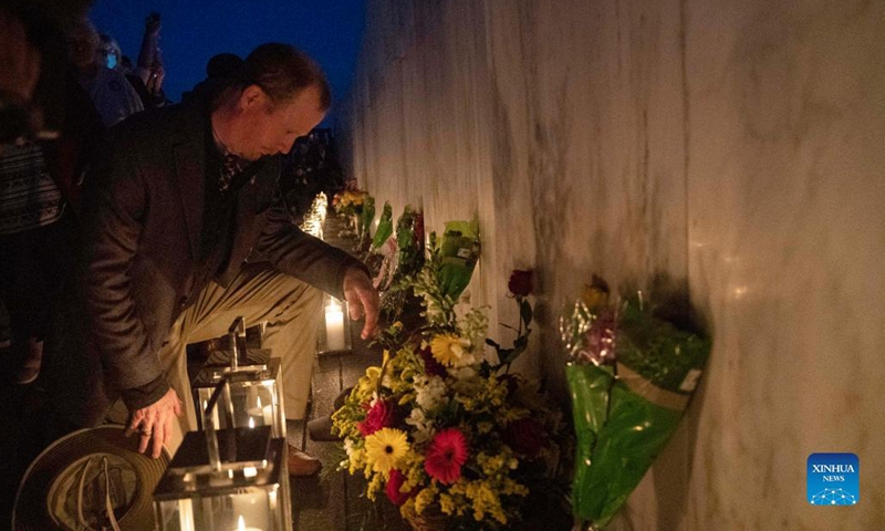 People visit the Wall of Names during a candlelight memorial to the passengers and crew of United Airlines Flight 93 in Shanksville, Pennsylvania, the United States, Sept. 10, 2021. Memorials were held at the Flight 93 National Memorial in Pennsylvania to mark the 20th anniversary of the Sept. 11 attacks. (Photo: Xinhua)