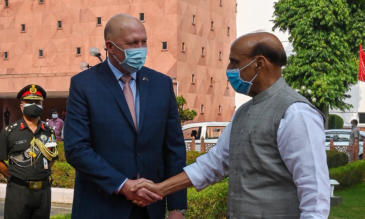 Australia's Defence Minister Peter Dutton (L) shakes hands with his Indian counterpart Rajnath Singh during a ceremonial reception in New Delhi on September 10, 2021.
 Photo: AFP
