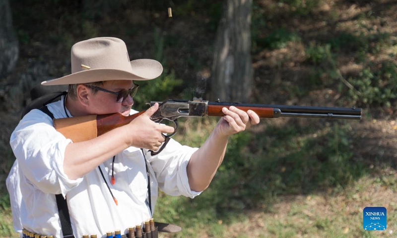 A man competes at the Cowboy Action Shooting Hungarian Championship in Jaszfelsoszentgyorgy, Hungary on Sept. 11, 2021. (Photo: Xinhua)