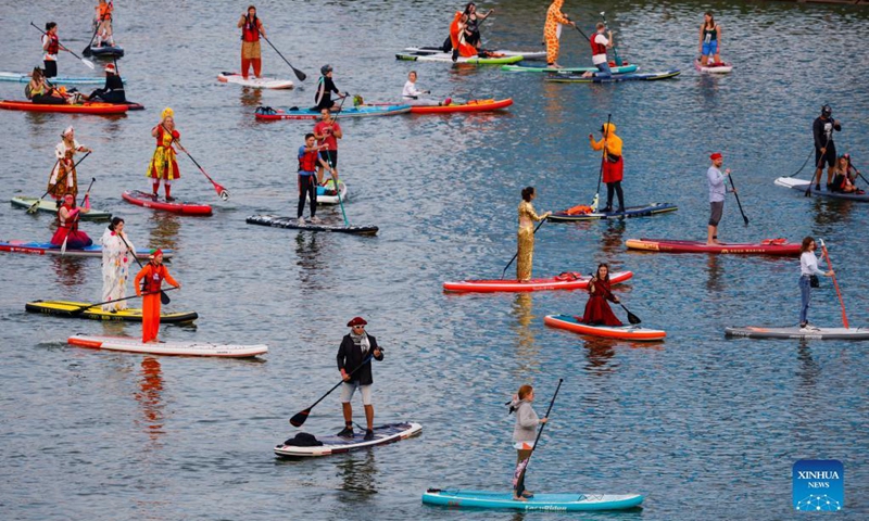 People take part in the Open Water SUP Fest 2021 in Moscow, Russia, on Sep. 12, 2021.Photo: Xinhua 