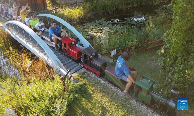 People ride on miniature train carriages at the Garden Railway Festival held in Hungarian Railway Museum in Budapest, Hungary on Sept. 12, 2021.Photo: Xinhua