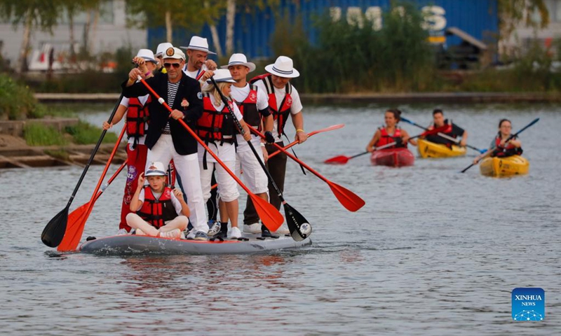 People take part in the Open Water SUP Fest 2021 in Moscow, Russia, on Sep. 12, 2021.Photo: Xinhua 