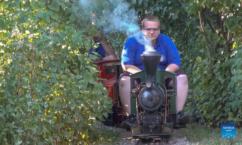 People ride on miniature train carriages at the Garden Railway Festival held in Hungarian Railway Museum in Budapest, Hungary on Sept. 12, 2021.Photo: Xinhua