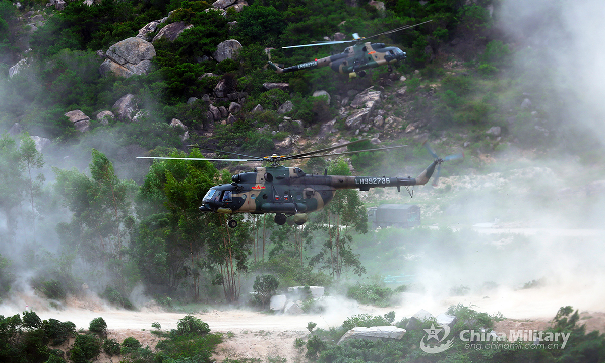 The military helicopters attached to an army aviation brigade under the PLA 72nd Group Army fly at an ultralow altitude in the valley during the defense penetration training on August 30, 2021. (eng.chinamil.com.cn/Photo by Zhang Huanpeng)