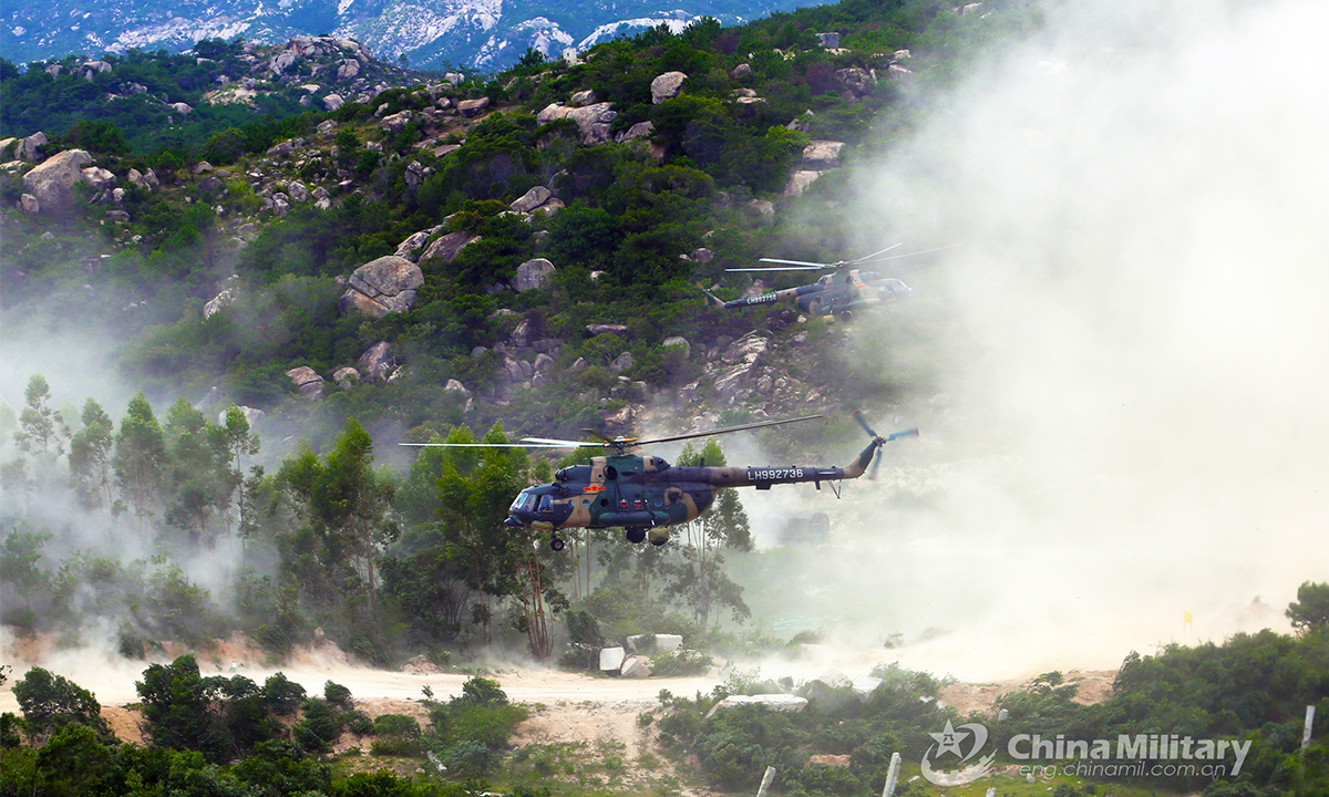 The military helicopters attached to an army aviation brigade under the PLA 72nd Group Army fly at an ultralow altitude in the valley during the defense penetration training on August 30, 2021. (eng.chinamil.com.cn/Photo by Zhang Huanpeng)