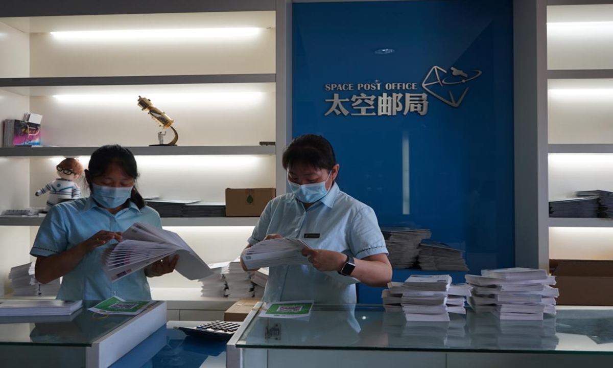 A new postal service offered by China Post has brought back the now forgotten handwritten letters as people scramble to send theirs' to space for a mere 19 yuan ($3) each. Photo: The Paper