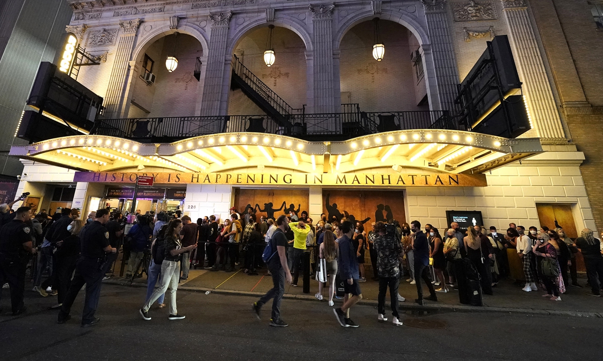 People wait to attend the Broadway musical <em>Hamilton</em> after showing their vaccination cards in New York on Tuesday. 
Top: An audience waits for the start of the Broadway musical <em>Hamilton</em> in New York on Tuesday. Photos: AFP