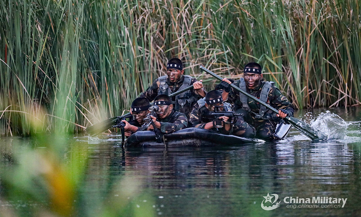 Special operations members assigned to the PLA Air Force sneak into the mock enemy's rear in an assault boat for reconnaissance during the Hell Week extreme military training in late August. Within the week-long training courses, all the 75 participating members were required to complete 25 training subjects, including loaded march and surviving in the wild. (eng.chinamil.com.cn/Photo by Yang Haofeng)