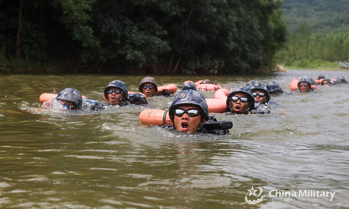 Special operations members assigned to the PLA Air Force swim across the river in full combat gear during the Hell Week extreme military training in late August. Within the week-long training courses, all the 75 participating members were required to complete 25 training subjects, including loaded march and surviving in the wild. (eng.chinamil.com.cn/Photo by Yang Haofeng)