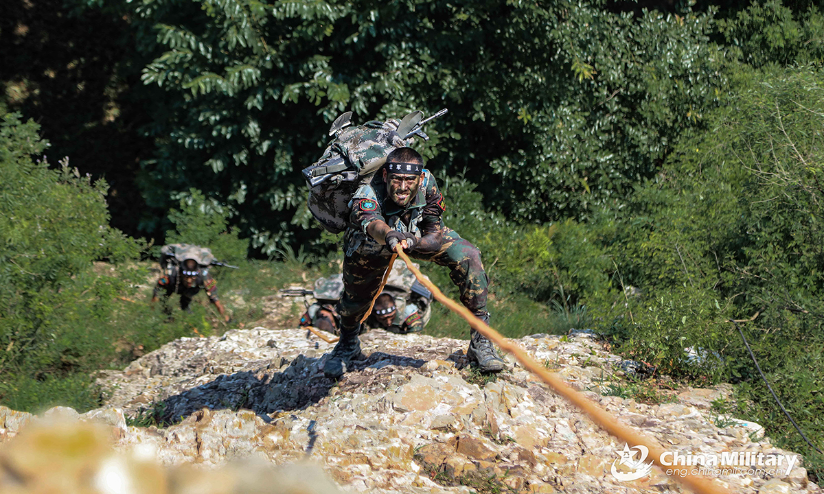 Special operations members assigned to the PLA Air Force rappel onto a cliff during the Hell Week extreme military training in late August. Within the week-long training courses, all the 75 participating members were required to complete 25 training subjects, including loaded march and surviving in the wild. (eng.chinamil.com.cn/Photo by Yang Haofeng)
