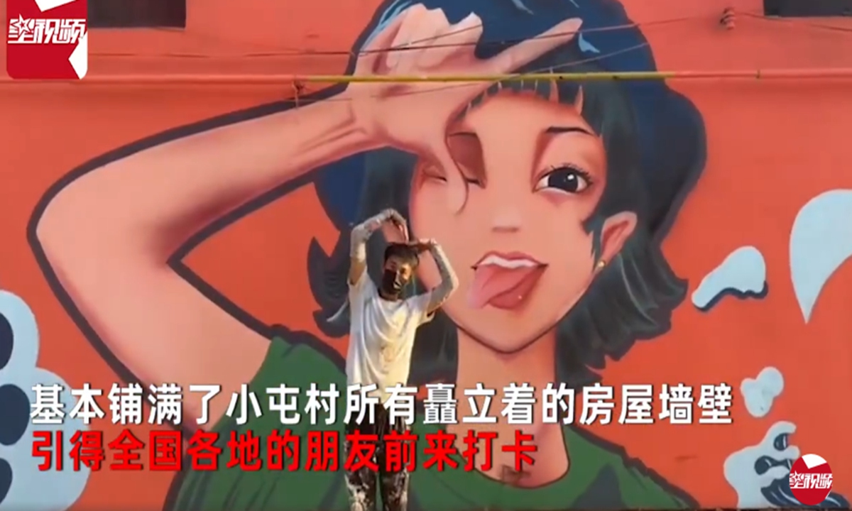 A youngster in Xinxiang, Central China's Henan Province, reportedly took two years painting cartoons on walls of his hometown village, making the village a scenic spot in local region. Photo: A screenshot of the Star Video