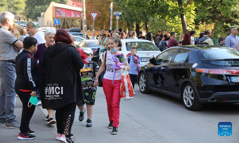 Parents stand outside a school in Sofia, Bulgaria, Sept. 15, 2021. Despite the severe COVID-19 pandemic in Bulgaria, all the 2,357 schools across the country opened their classrooms for the new school year. Photo: Xinhua
