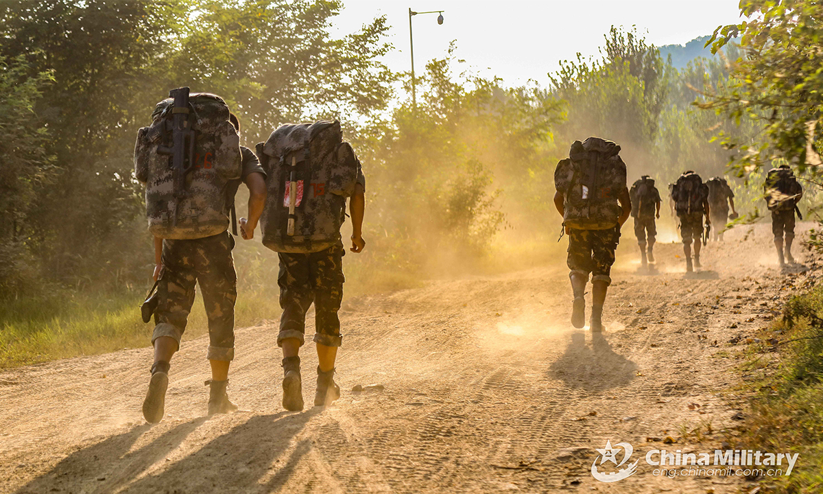 Special operations members assigned to the PLA Air Force conduct 10-kilometer-race with full combat gear during the Hell Week extreme military training in late August. Within the week-long training courses, all the 75 participating members were required to complete 25 training subjects, including loaded march and surviving in the wild. (eng.chinamil.com.cn/Photo by Yang Haofeng) 