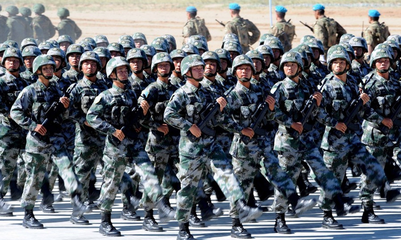 People's Liberation army soldiers participate in the opening ceremony of joint exercise code-named Peace Mission 2014 involving member states of the Shanghai Cooperation Organization (SCO) in Zhurihe, north China's Inner Mongolia Autonomous Region, Aug. 24, 2014.(Photo: Xinhua)