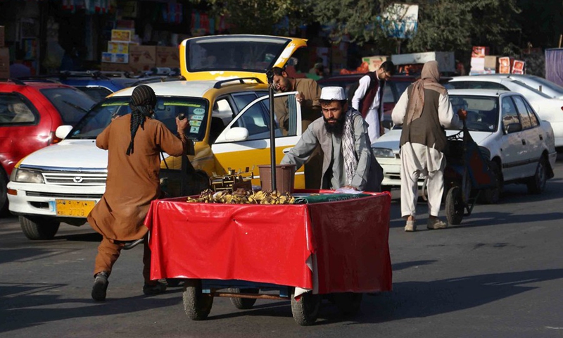 Vendors push their handcarts on a street in Kabul, capital of Afghanistan, Sept. 15, 2021.(Photo: Xinhua)
