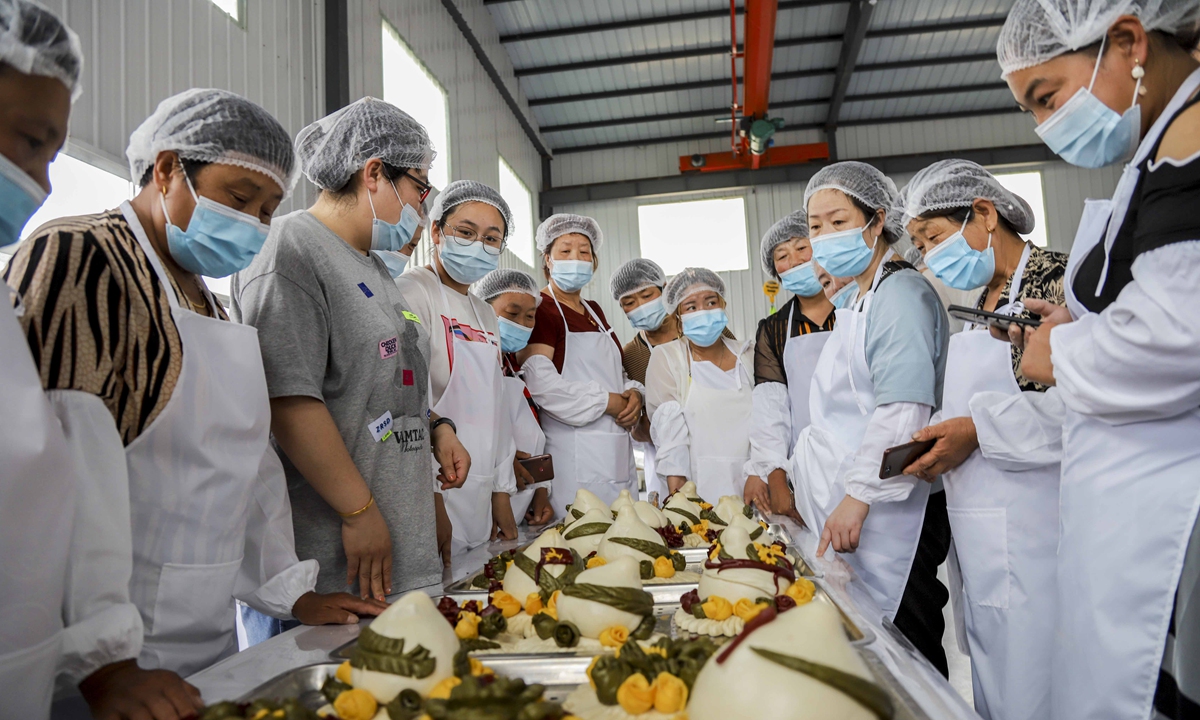 The Human Resources and Social Security Bureau of Qingdao West Coast New Area in East China's Shandong Province conducted Chinese pastry skills training for more than 30 rural women from Huangzhuang village on June 29. Photo: IC