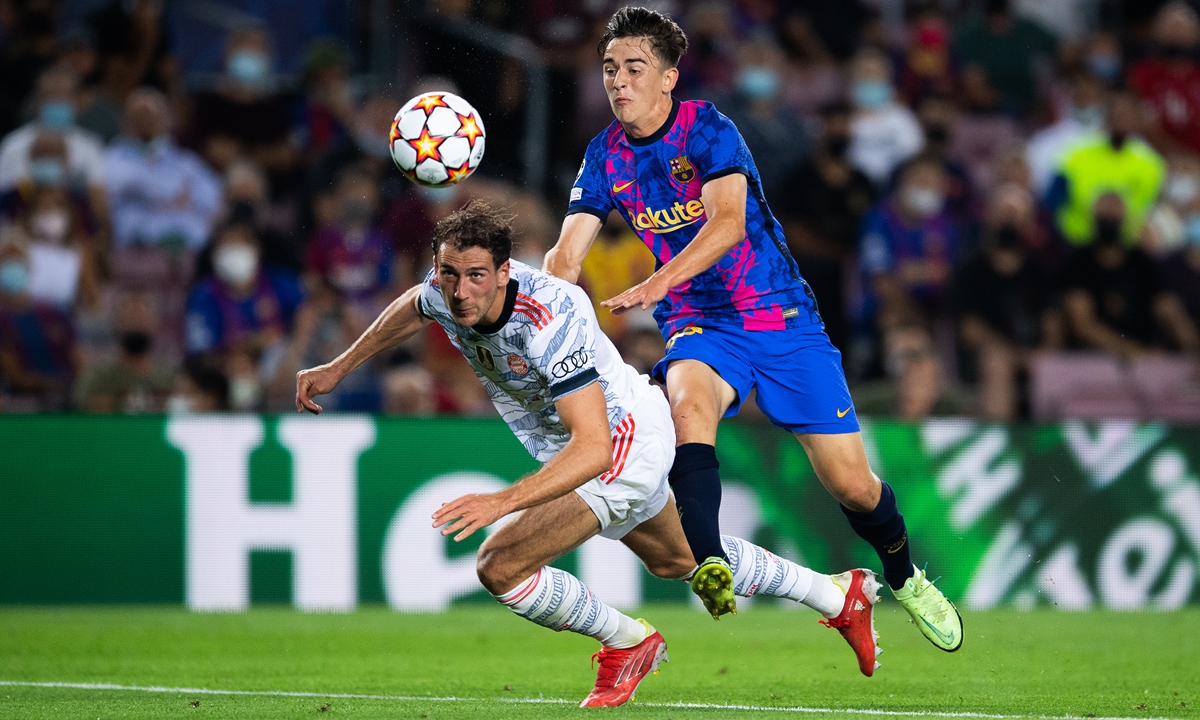 Gavi (right) of Barcelona competes for the ball with Leon Goretzka of Bayern Munich on Tuesday in Barcelona, Spain. Photo: VCG