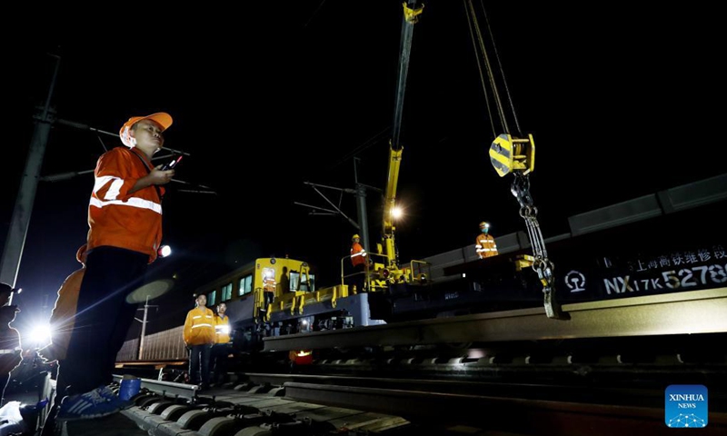 Maintenance workers change rails on the high-speed railroad linking east China's Shanghai and the city of Hangzhou in east China's Zhejiang Province, Sept. 18, 2021. (Xinhua/Fang Zhe)