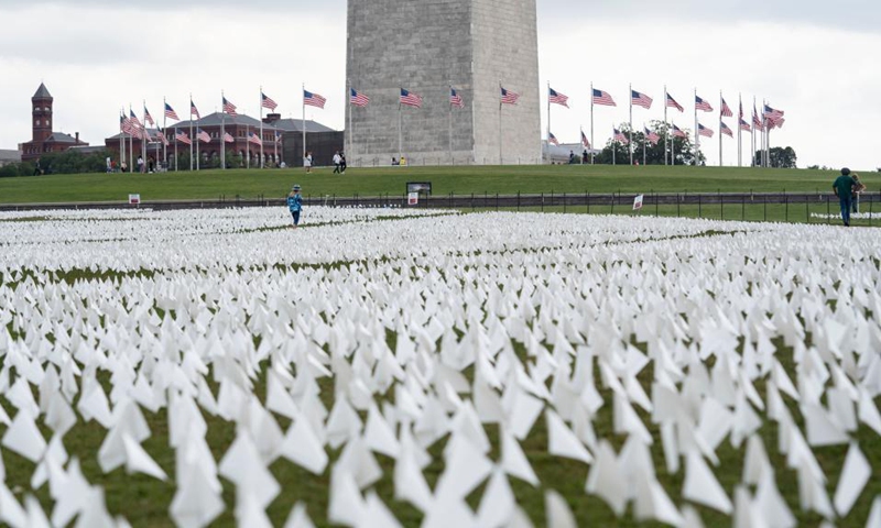 White flags are seen on the National Mall in Washington, D.C., the United States, on Sept. 16, 2021. More than 660,000 white flags were installed here to honor the lives lost to COVID-19 in the United States.Photo:Xinhua