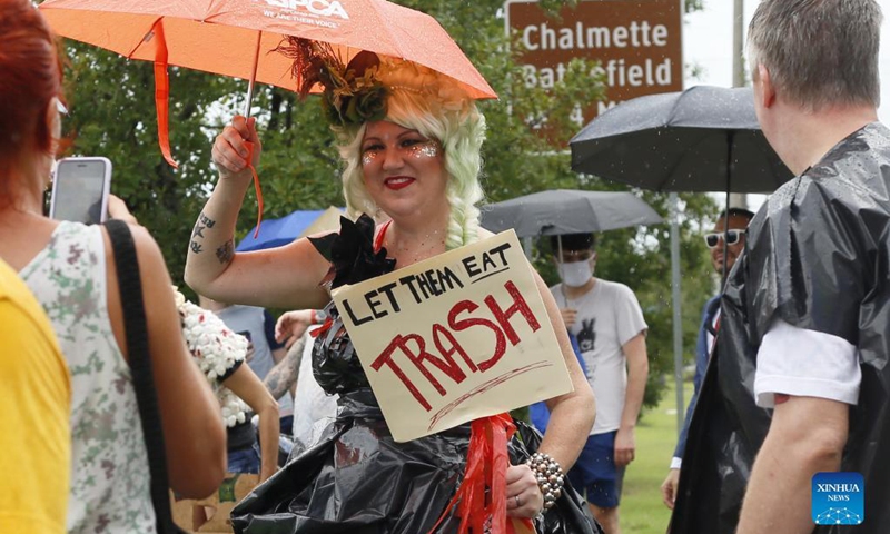 A woman in garbage-style costume takes part in a trash parade in New Orleans, Louisiana, the United States, on Sept. 18, 2021. Hundreds of residents in New Orleans joined the trash parade on Saturday to protest the city's sanitation. (Photo by Lan Wei/Xinhua)