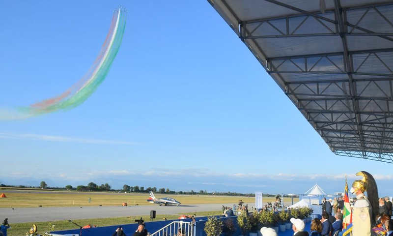 People watch a performance of the Italian Frecce Tricolori aerobatic squad during an airshow in Rivolto, Italy, on Sept. 18, 2021. The Italian Air Force held the airshow to mark the 60th anniversary of the Frecce Tricolori here on Saturday. (Str/Xinhua)