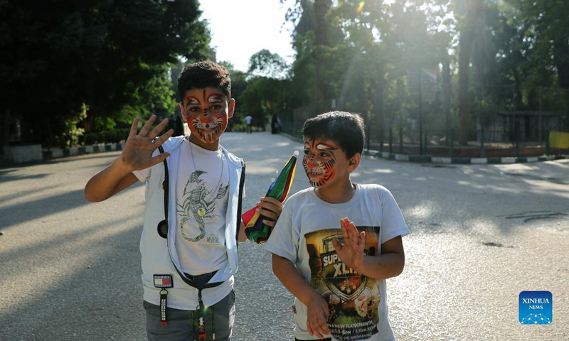 Children with face painting pose for a photo at the Giza Zoo in Giza, Egypt, on Sept. 18, 2021. Opened in 1891 and as the largest zoo in Egypt and the Middle East, Giza Zoo is a main destination for Egyptian families with their children on holidays. (Xinhua/Wang Dongzhen)
