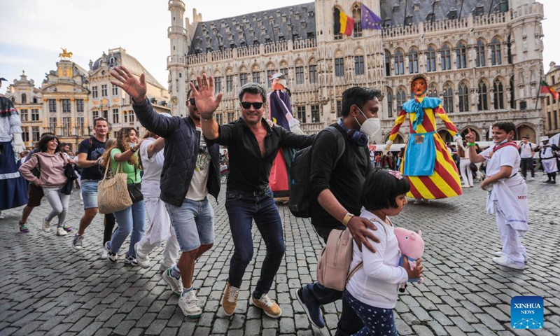 People dance during the Folklorissimo, or the Festival of Folklore, at the Grand-Place in Brussels, Belgium, on Sept. 18, 2021. (Xinhua/Zheng Huansong) 