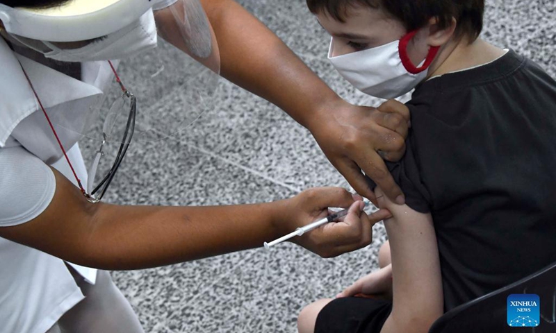 A child receives a dose of COVID-19 vaccine at a school in Havana, Cuba, Sep 16, 2021.Photo:Xinhua