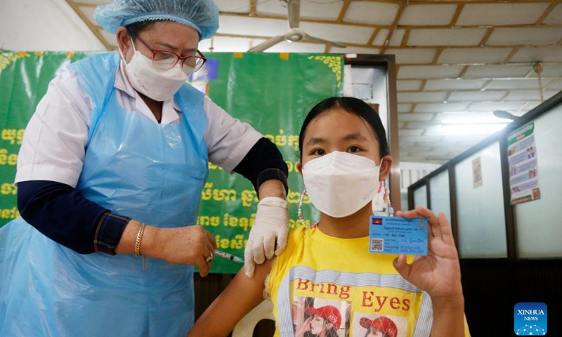 A girl receives her first dose of COVID-19 vaccine at an inoculation center in Phnom Penh, Cambodia on Sept. 20, 2021.(Photo: Xinhua)