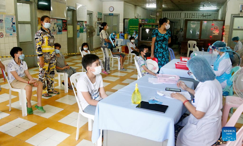 Children register for the first dose of COVID-19 vaccine at an inoculation center in Phnom Penh, Cambodia on Sept. 20, 2021.  (Photo: Xinhua)