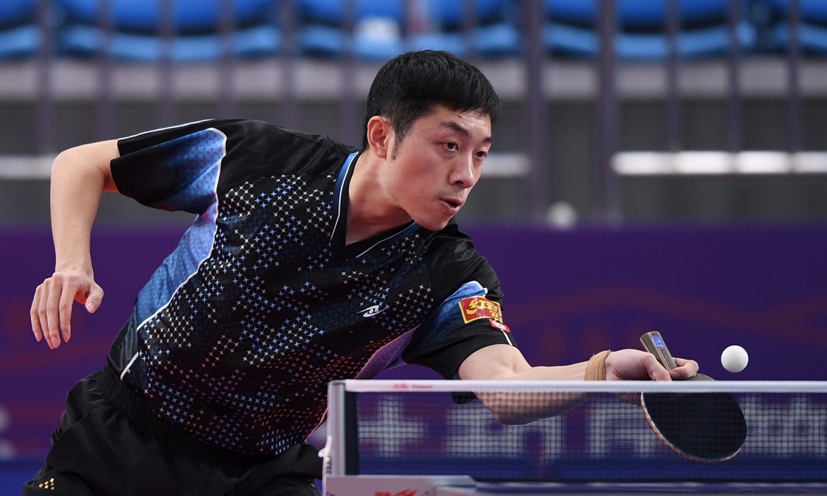 Xu Xin hits a return in the table tennis men's team quarterfinal at the National Games on Monday in Yan'an, Shaanxi Province. Photo: VCG