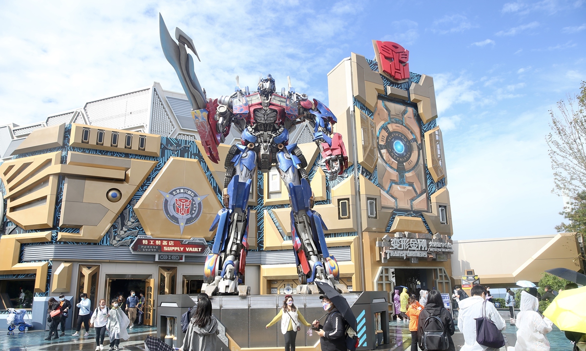 Tourists enter the Transformers section of the Universal Beijing Resort on Monday, one day ahead of the Mid-Autumn Festival in China. The highly-anticipated resort officially opened for business on Monday after 19 days of trial operation. Photo: cnsphoto