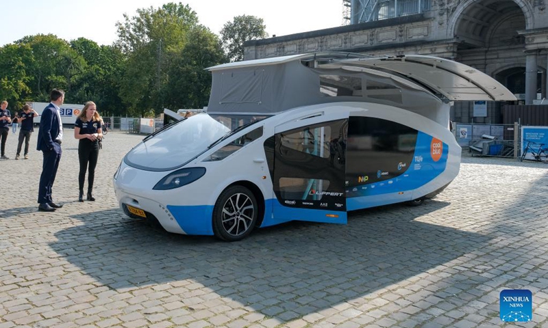 Photo taken on Sept. 20, 2021 shows Stella Vita, a solar-powered recreational vehicle, in Brussels, Belgium. Designed by the solar team of Eindhoven University of Technology, Stella Vita is equipped with solar panels on the roof, through which the vehicle generates enough energy to drive, shower, watch TV, charge, etc. By using energy efficiently, Stella Vita can travel up to 730 km on a sunny day.(Photo: Xinhua)