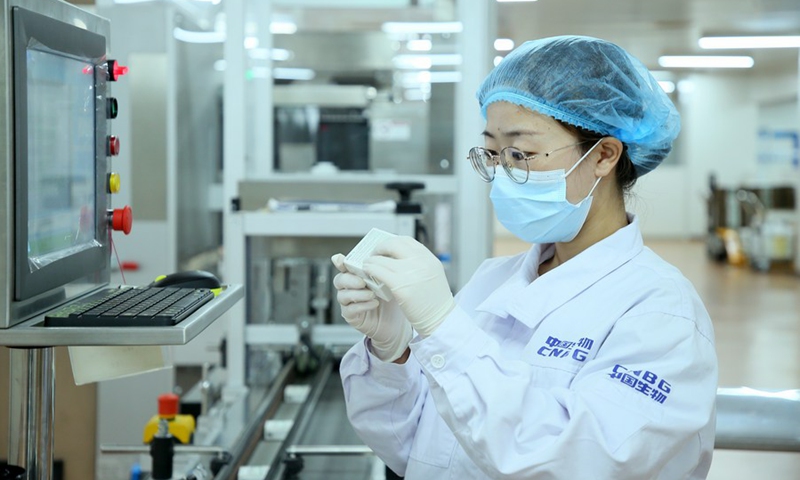 A staff member checks the packaging of the Sinopharm vaccines in Beijing, capital of China, May 31, 2021.(Photo: Xinhua)
