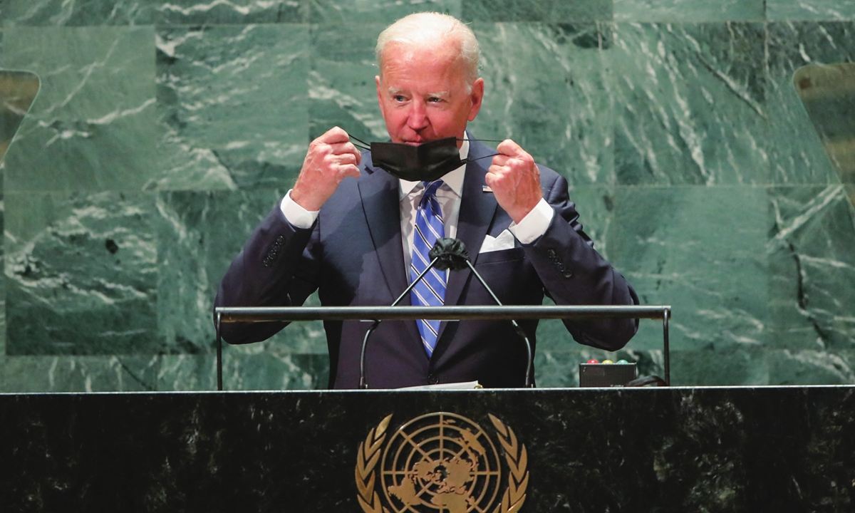 US President Joe Biden takes off his protective facemask as he arrives to speak at the 76th Session of the UN General Assembly on Tuesday in New York. This is the first speech to the world body by Biden.    Photo: AFP