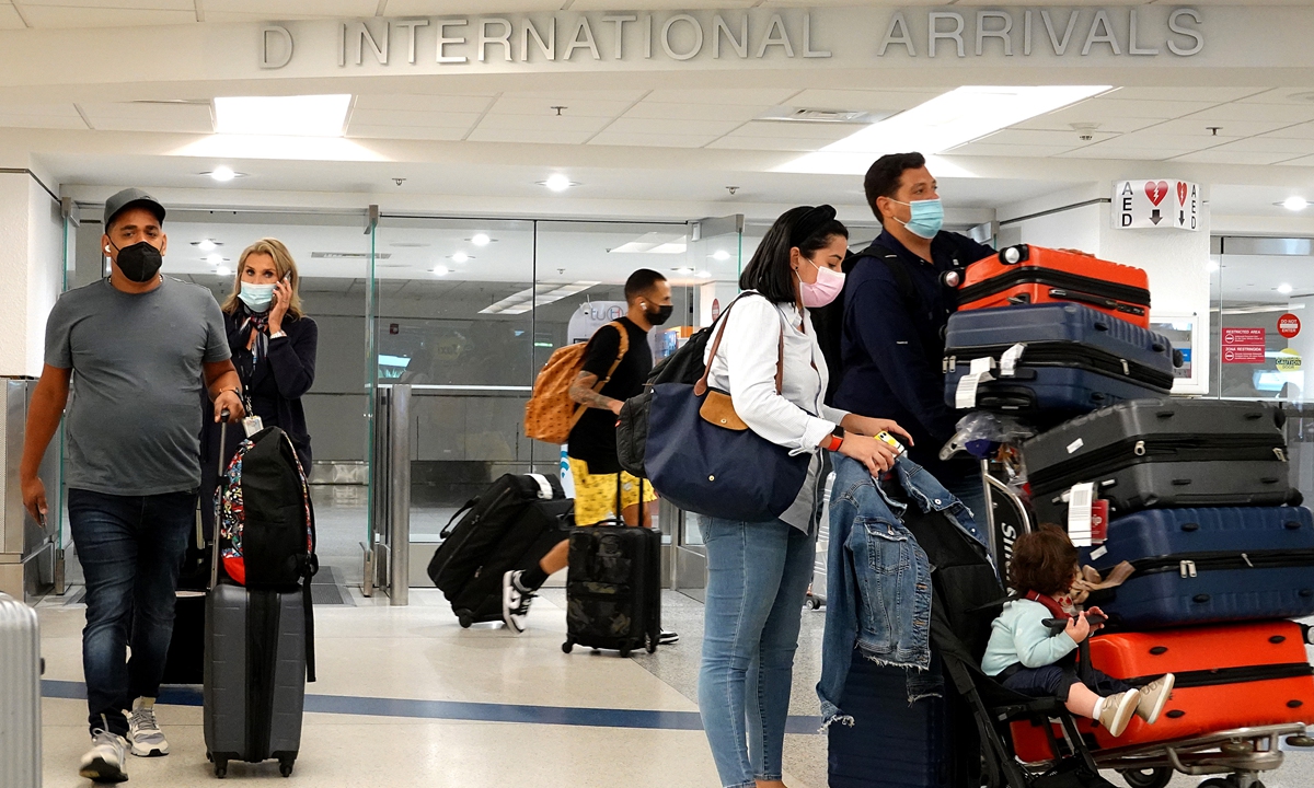 Travelers exit from the international arrivals door at Miami International Airport on Monday in Miami, Florida. Photo: VCG