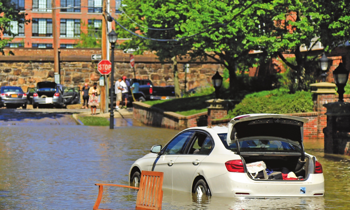  An abandoned car sits partially submerged in floodwaters in New York, the US on September 2, 2021.Photo: VCG