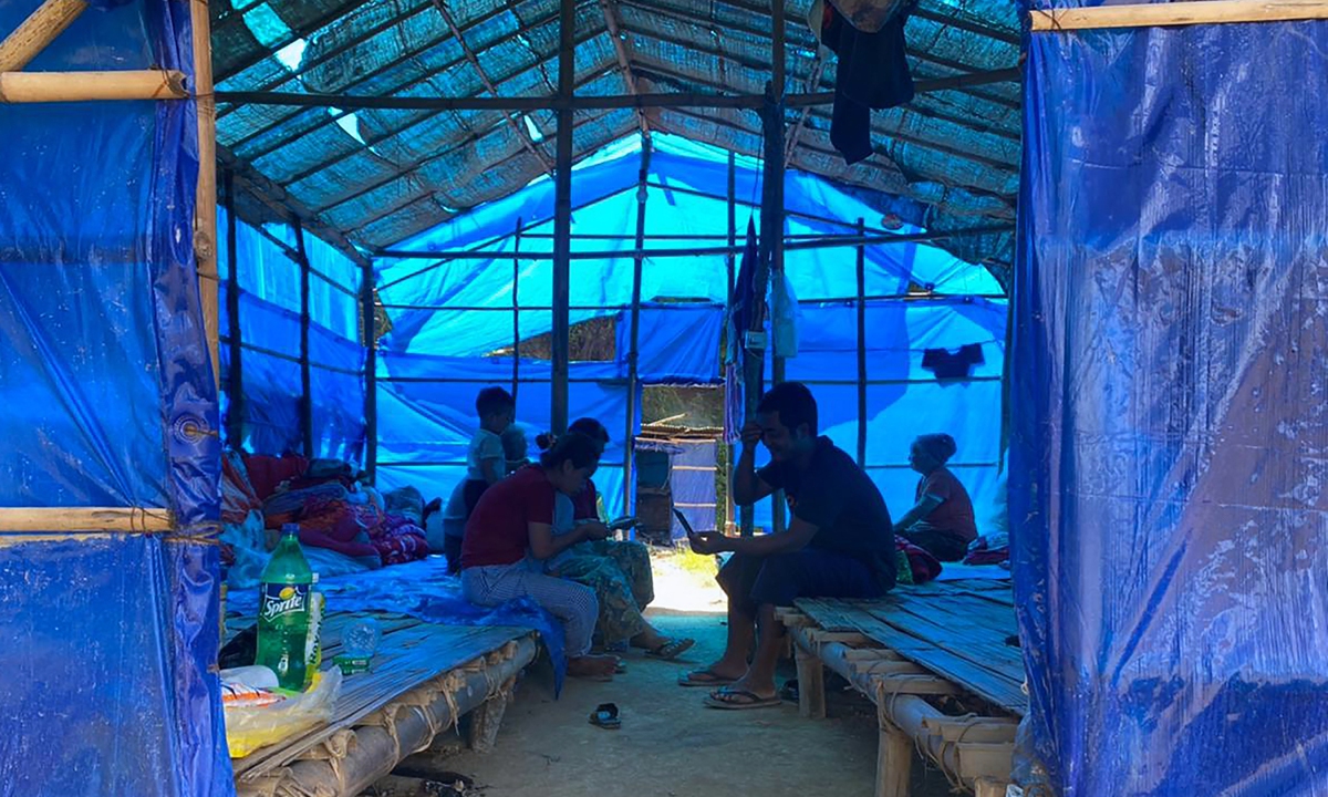 Refugees from Myanmar rest in a basic shelter at Farkawn quarantine camp in India's eastern state of Mizoram near the Myanmar border on Thursday, after they fled across the border following attacks by Myanmar's military on villages. Photo: AFP