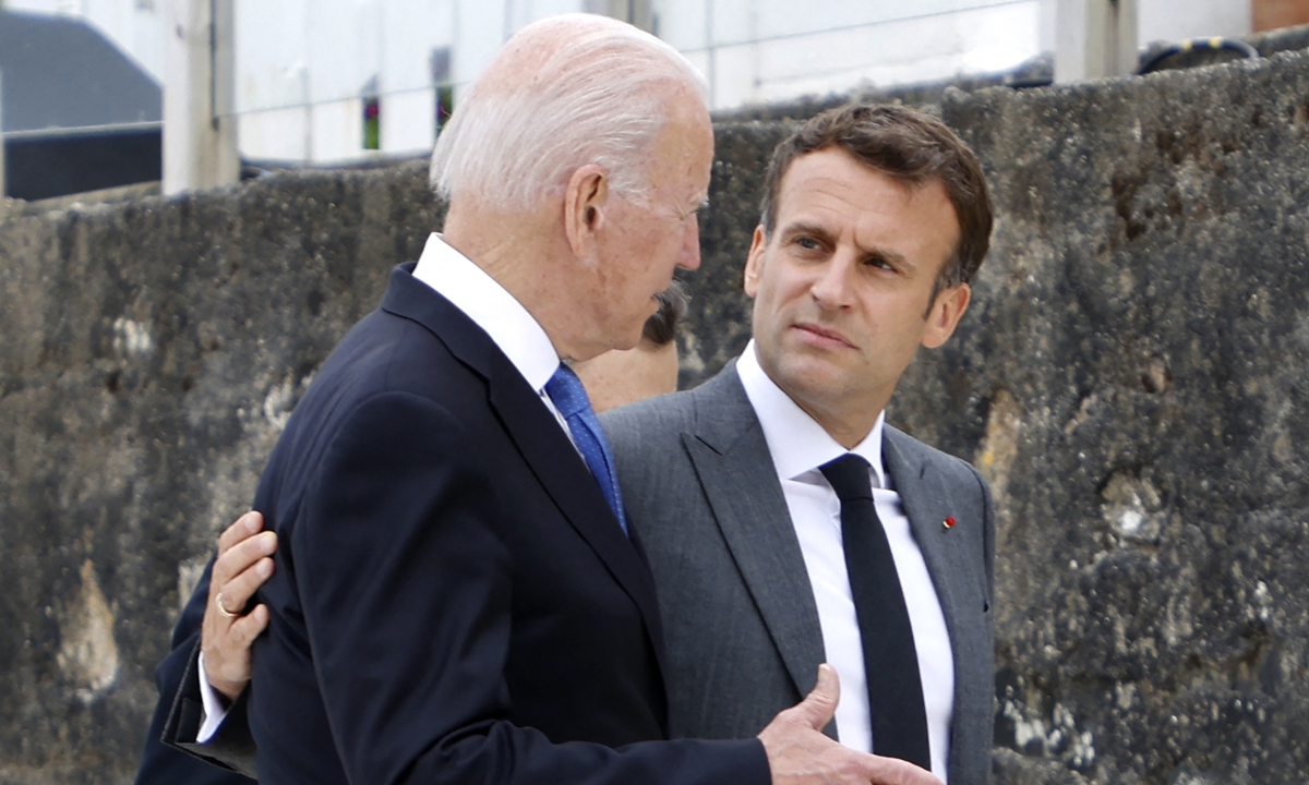 US President Joe Biden (left) and France's President Emmanuel Macron speak at the start of the G7 summit in Carbis Bay, Cornwall on June 11, 2021. Photo: AFP