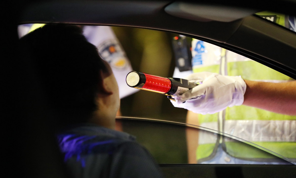 A person undergoes a breath test. File photo: VCG