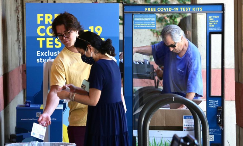 Students are seen at a COVID-19 self-testing station on campus of the University of California, Los Angeles (UCLA), in Los Angeles, the United States, Sept. 23, 2021.Photo:Xinhua