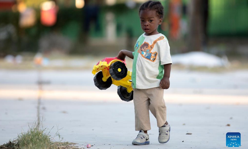 A child plays with a toy car at a migrant camp near the border with the US in Ciudad Acuna, Mexico, Sept. 24, 2021. Many of the migrants at the camp of Ciudad Acuna, near the border with the US, may try chances to enter the United States.Photo:Xinhua